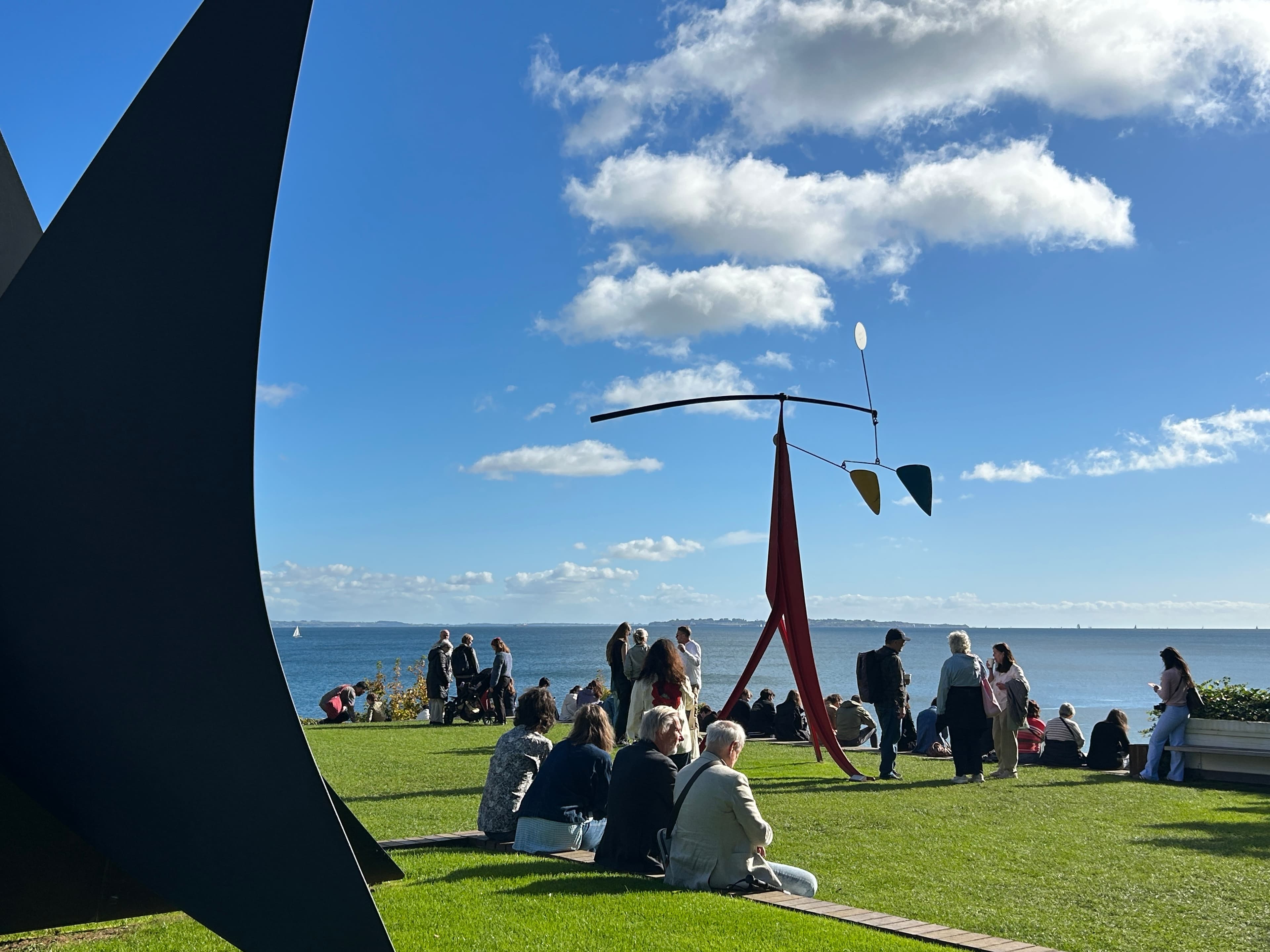 view from louisiana museum of the ocean flanked by calder statues on either side