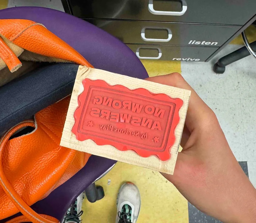 rubber stamp with no wrong answers logo